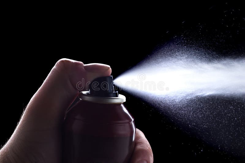 Deodorant in hand isolated on black