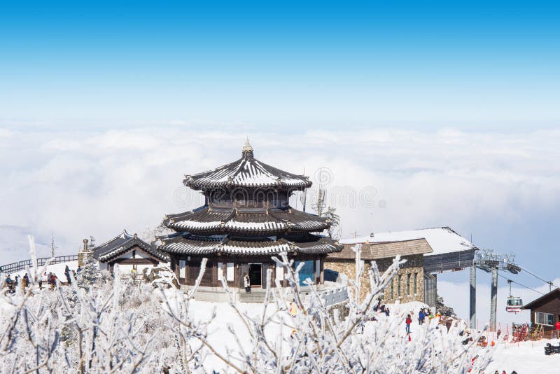 DEOGYUSAN,KOREA - JANUARY 23: Tourists taking photos of the beautiful scenery and skiing around Deogyusan,South Korea on January 23, 2015. DEOGYUSAN,KOREA - JANUARY 23: Tourists taking photos of the beautiful scenery and skiing around Deogyusan,South Korea on January 23, 2015.