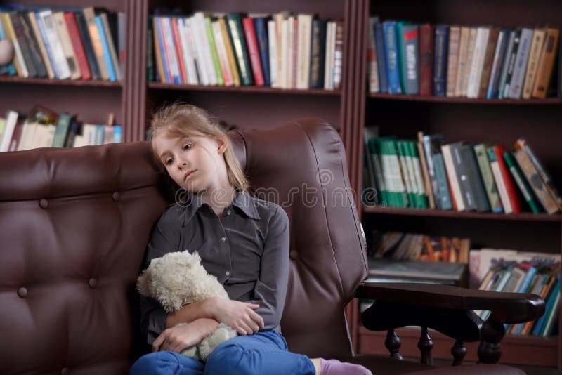 Depressed child with toy