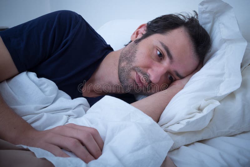 Depressed Man Lying in His Bed and Feeling Bad Stock Image Image of