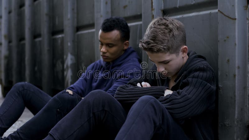 Depressed teen migrants illegally sailing on boat, hope for bright future royalty free stock images Depressed teen migrants illegally sailing on boat, hope for bright future royalty free stock images