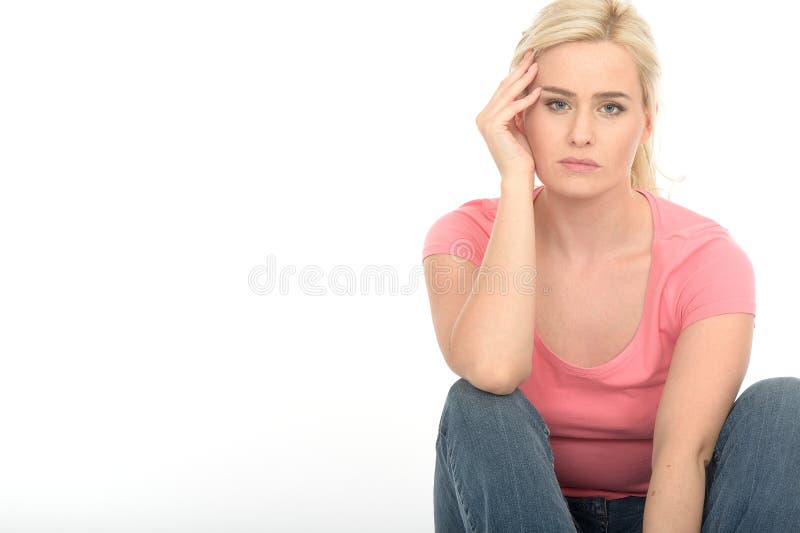 Depressed Thoughtful Unhappy Young Woman Sitting Alone on the Floor Looking Miserable royalty free stock images Depressed Thoughtful Unhappy Young Woman Sitting Alone on the Floor Looking Miserable royalty free stock images