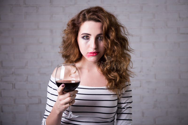 Depression Portrait of Sad Woman Crying and Drinking Wine Stock Photo