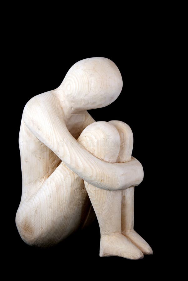 A statue of wood - depressed man or depression symbol. A statue of wood - depressed man or depression symbol