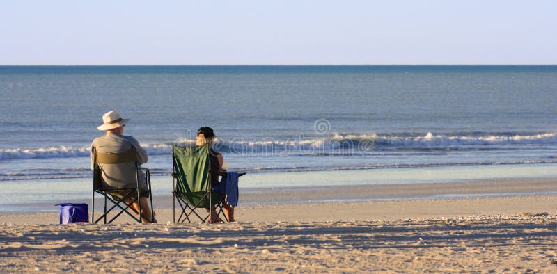 Couple relax at a lonely beach. Couple relax at a lonely beach