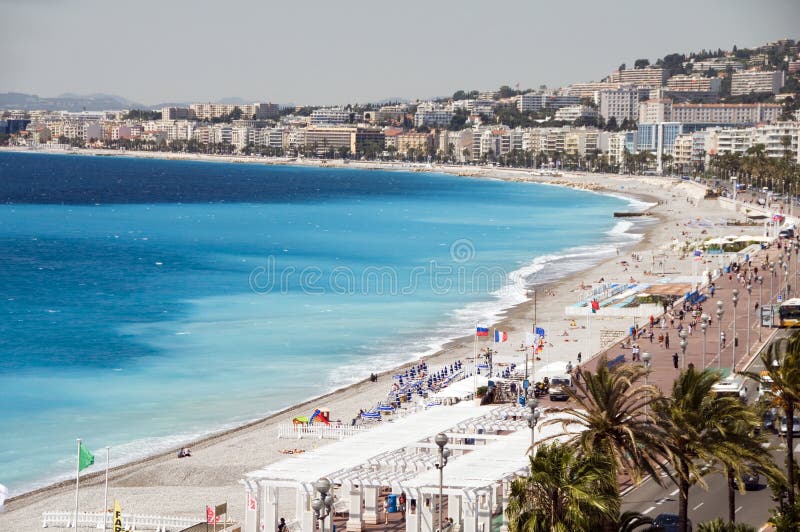 The French Riviera Cote d'azur Nice France beach on famous Promenade des Anglais hotel lined boulevard. The French Riviera Cote d'azur Nice France beach on famous Promenade des Anglais hotel lined boulevard