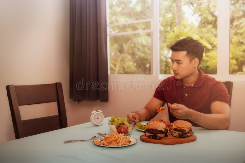 Concepts, problems, and disunity in the family : One young man sat for lunch alone, watching the empty chair without his wife who had eaten together because of family problems. Concepts, problems, and disunity in the family : One young man sat for lunch alone, watching the empty chair without his wife who had eaten together because of family problems