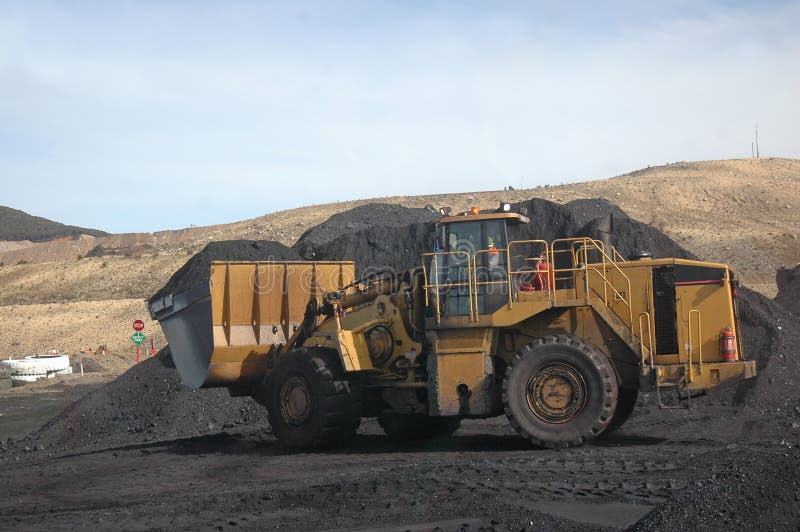 Payloader shifting coal to blender, New Zealand. Payloader shifting coal to blender, New Zealand