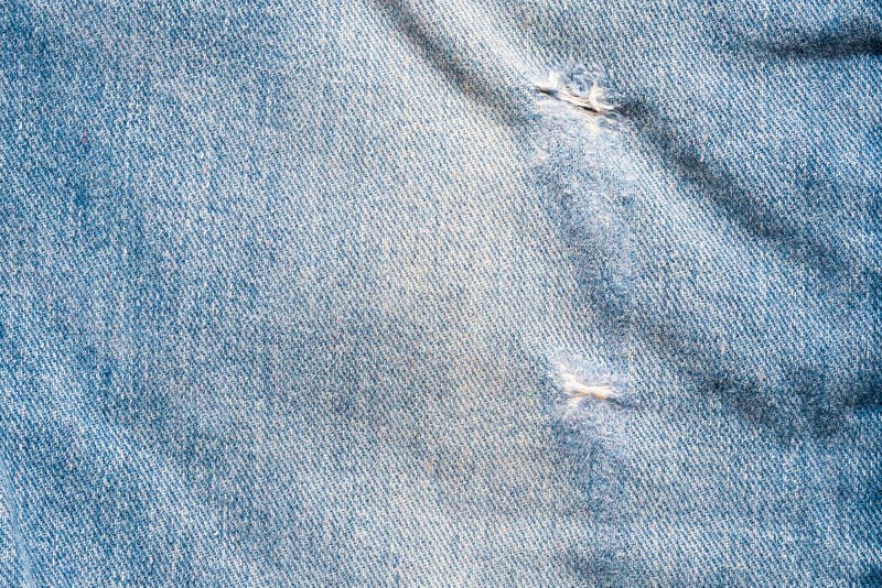 Der Modeentwurfsbeschaffenheitsnahaufnahmehintergrundes des Denims Blue Jeans gewalttätige Draufsicht stockbild
