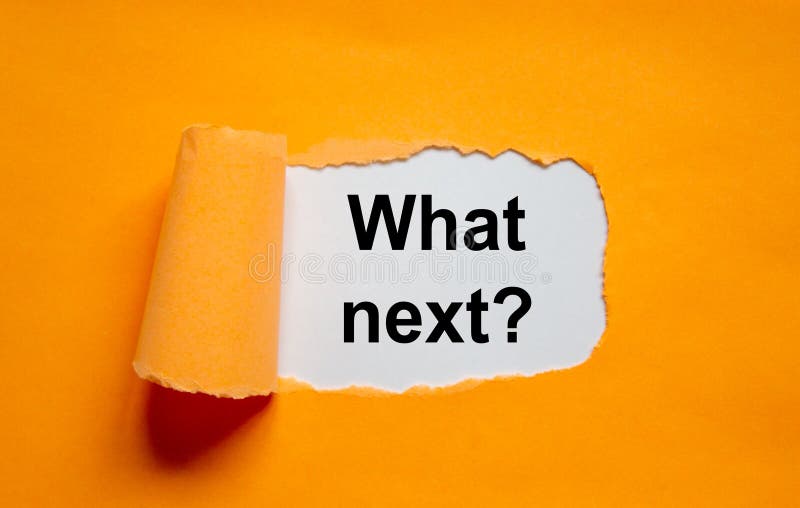 The text `what next` appearing behind torn orange paper. Business concept, copy space. The text `what next` appearing behind torn orange paper. Business concept, copy space.