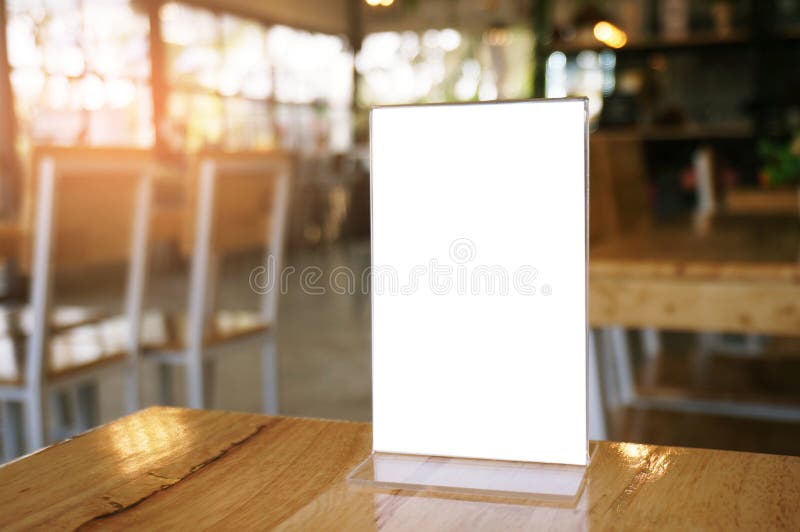 Mock up Menu frame standing on wood table in Bar restaurant cafe. space for text. Mock up Menu frame standing on wood table in Bar restaurant cafe. space for text.