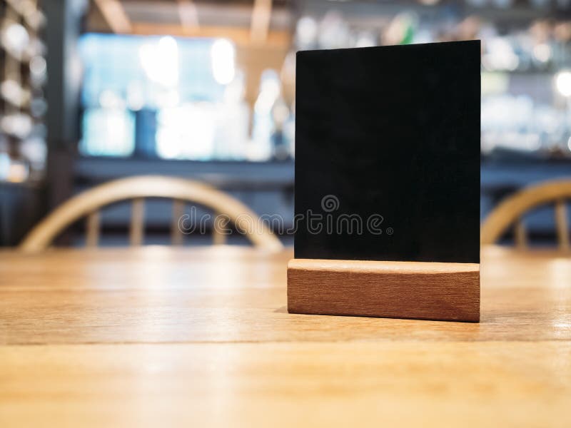 Mock up Menu frame on Table counter in Restaurant cafe background. Mock up Menu frame on Table counter in Restaurant cafe background