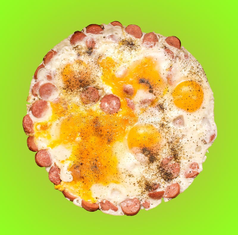 Desayuno de huevos fritos con las salchichas y la salchicha con pimienta en un fondo aislado verde foto de archivo libre de regalías Desayuno de huevos fritos con las salchichas y la salchicha con pimienta en un fondo aislado verde foto de archivo libre de regalías