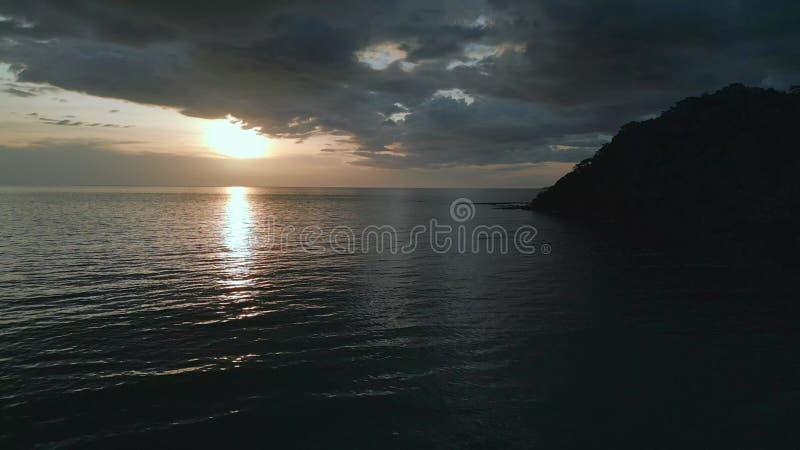 Beach in evening, headland jungle sunset dark Wonderful aerial view flight drone