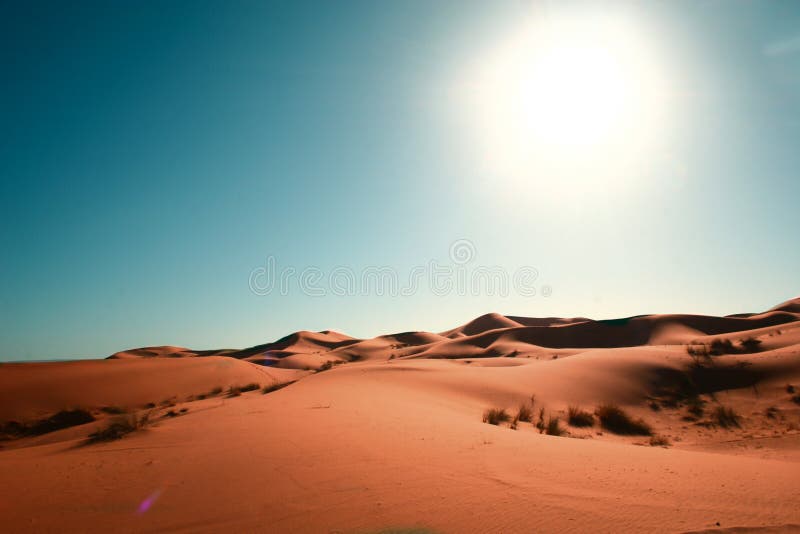 Desert, blue sky and sun stock photo. Image of landscape 12976730