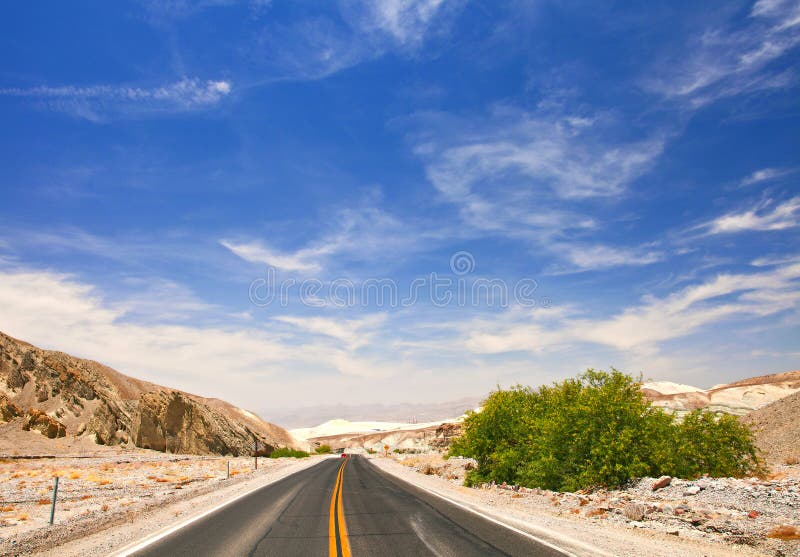 Desert road and blue sky in Death Valley national park stock photos Desert road and blue sky in Death Valley national park stock photos