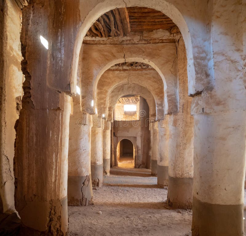 Desert town of Mhamid, Morocco village with sand dunes and old muslim mosque in north Africa, old narrow streets, traditional clay