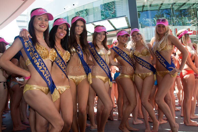 GOLD COAST, AUSTRALIA - OCTOBER 2, 2011: Unidentified participants prepare for march of successful attempt of Guinness World Record longest bikini parade on October 2,2011 in Gold Coast, Queensland, Australia. GOLD COAST, AUSTRALIA - OCTOBER 2, 2011: Unidentified participants prepare for march of successful attempt of Guinness World Record longest bikini parade on October 2,2011 in Gold Coast, Queensland, Australia