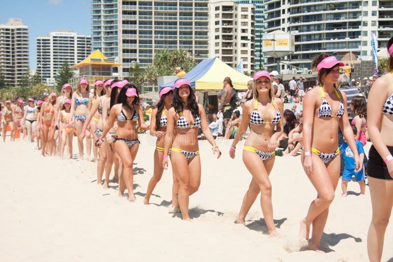 GOLD COAST, AUSTRALIA - OCTOBER 2, 2011: Unidentified participants march in successful Guinness World Record longest bikini parade on October 2,2011 in Gold Coast, Queensland, Australia. GOLD COAST, AUSTRALIA - OCTOBER 2, 2011: Unidentified participants march in successful Guinness World Record longest bikini parade on October 2,2011 in Gold Coast, Queensland, Australia