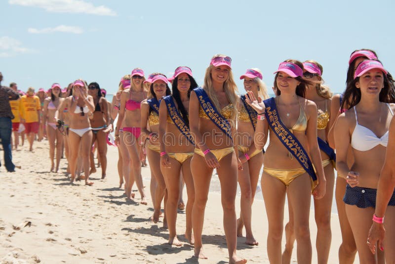 GOLD COAST, AUSTRALIA - OCTOBER 2, 2011: Unidentified participants march in successful Guinness World Record longest bikini parade on October 2,2011 in Gold Coast, Queensland, Australia. GOLD COAST, AUSTRALIA - OCTOBER 2, 2011: Unidentified participants march in successful Guinness World Record longest bikini parade on October 2,2011 in Gold Coast, Queensland, Australia