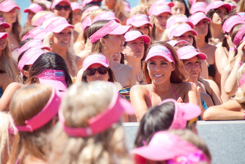 GOLD COAST, AUSTRALIA - OCTOBER 2, 2011: Unidentified participants march in successful Guinness World Record longest bikini parade on October 2,2011 in Gold Coast, Queensland, Australia. GOLD COAST, AUSTRALIA - OCTOBER 2, 2011: Unidentified participants march in successful Guinness World Record longest bikini parade on October 2,2011 in Gold Coast, Queensland, Australia