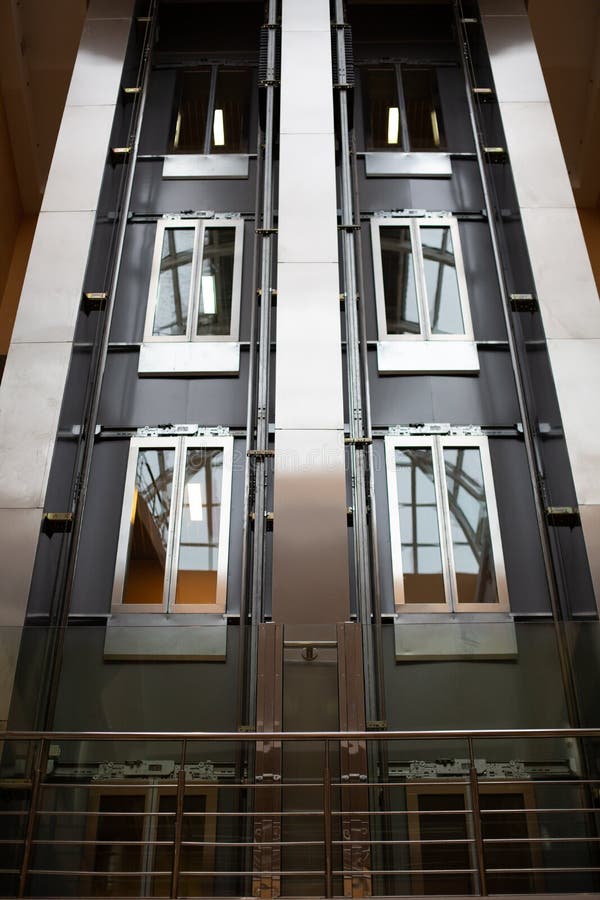Design modern inside metal glass stairs elevator stock photography