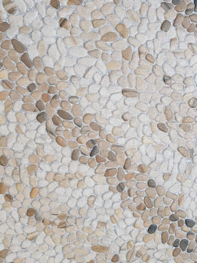 Design von Streifen mit Steinen im braunen und weißen, strukturierten Hintergrund. Gebäude mit Art pflasterte Oberflächenmaterial, Kiesfarbe für Dekoration die im Freien, Böden und Wände, mit diagonalen Linien der intensiven Farbe und der weichen Steine