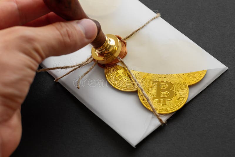 The designed envelope with a golden stamp is used for sending golden bitcoin coins as a gift. There are big golden BTC