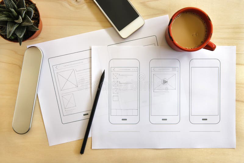 Designer desk with mobile application wireframe royalty free stock photography
