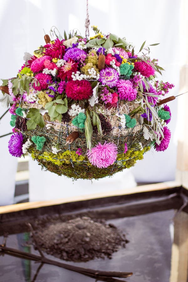 Designer wedding ball of flowers, moss and grass called water stock photos Designer wedding ball of flowers, moss and grass called water stock photos