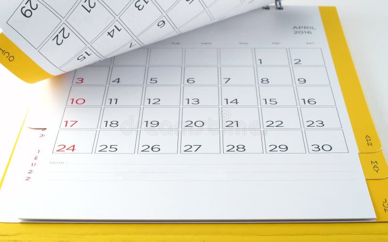 cardboard desk calendar with days and dates of April 2016 in grid with blank lines for text notes