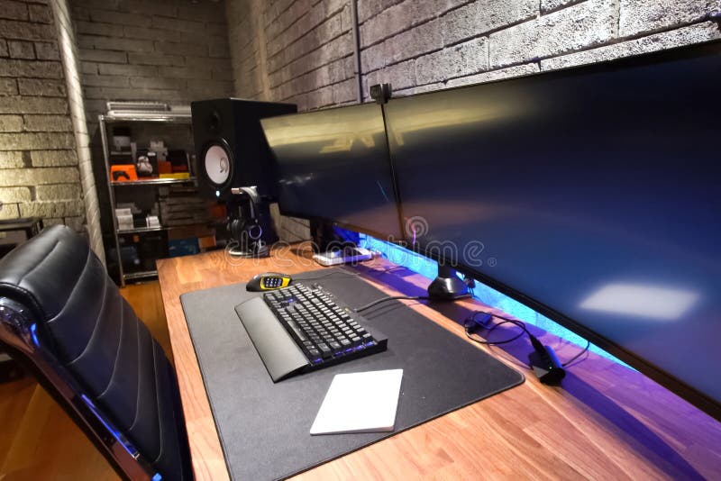 Desk gamer with two monitors. stock images