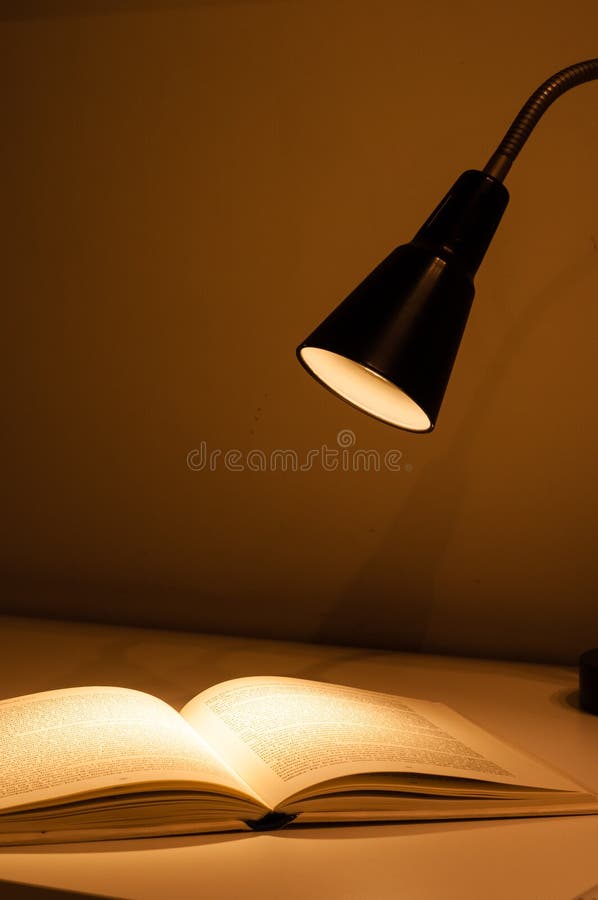 Desk lamp and books