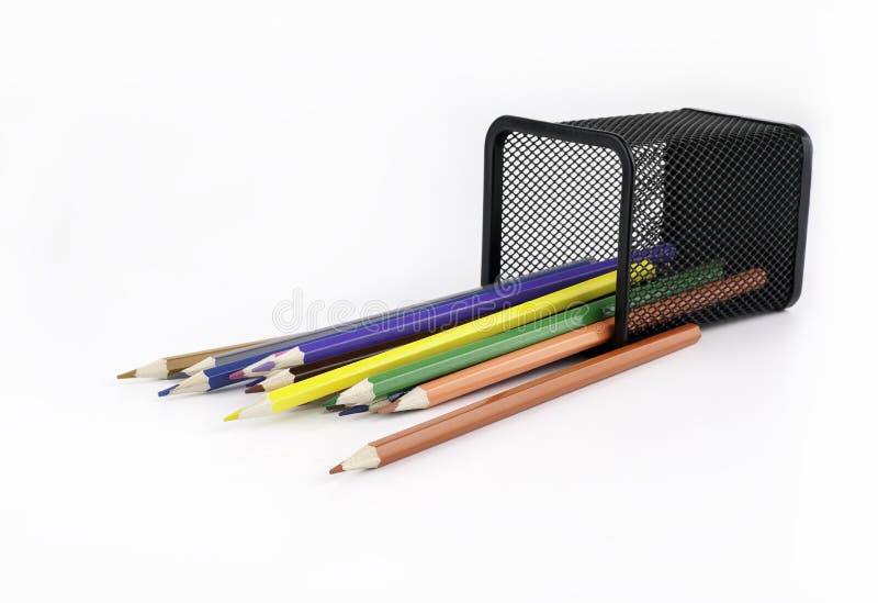 Desk organizer filled with colored pencils isolated on white background