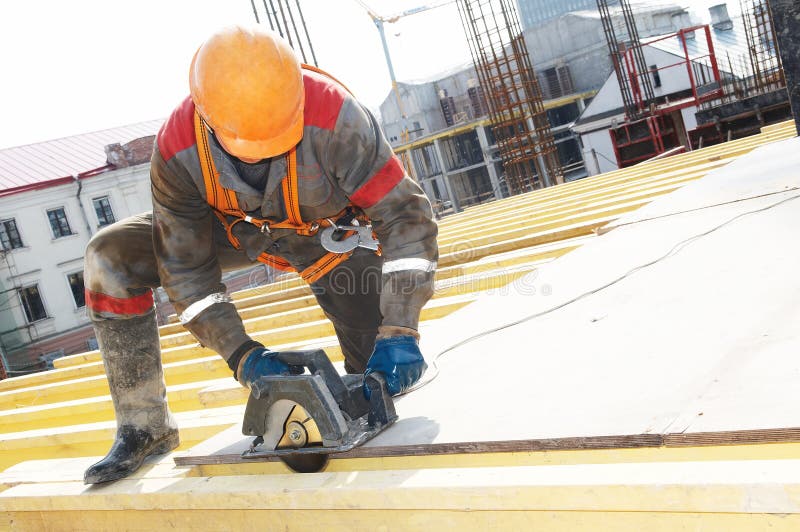 Builder working in protective wear, helmet and equipment. Builder working in protective wear, helmet and equipment