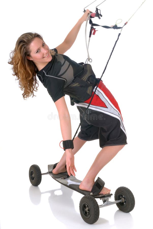 Young attractive female doing mountain board kite surfing. Studio shot, reflective surface,. Young attractive female doing mountain board kite surfing. Studio shot, reflective surface,