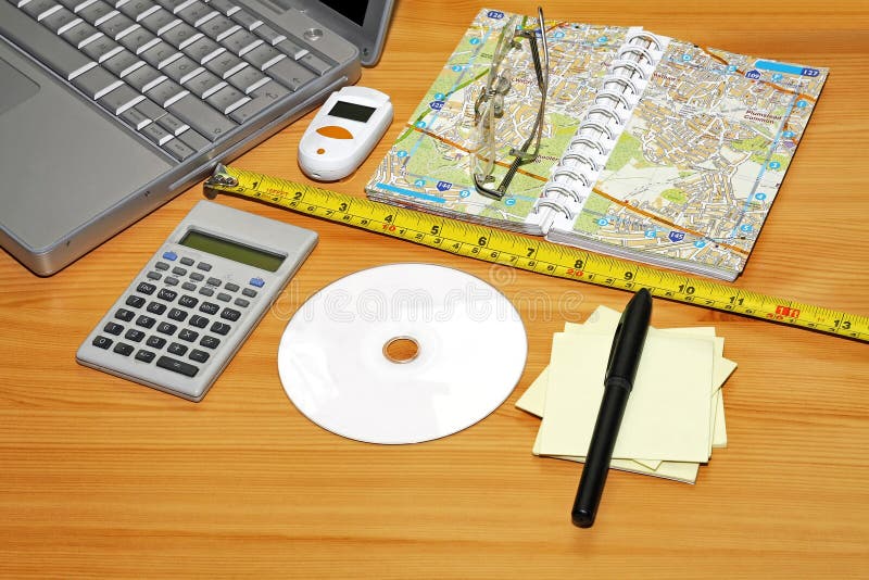 Desktop. Notebook Map and Calculator at Wooden Desk
