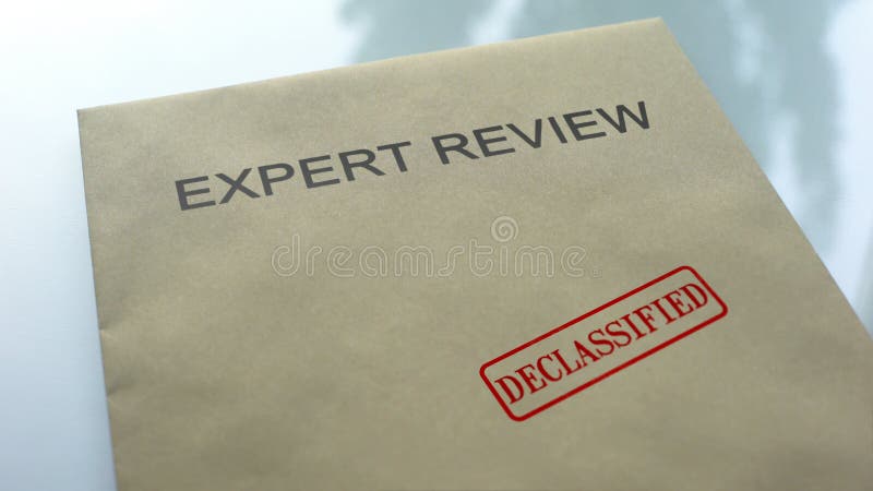 Expert review declassified, seal stamped on folder with important documents, stock photo. Expert review declassified, seal stamped on folder with important documents, stock photo