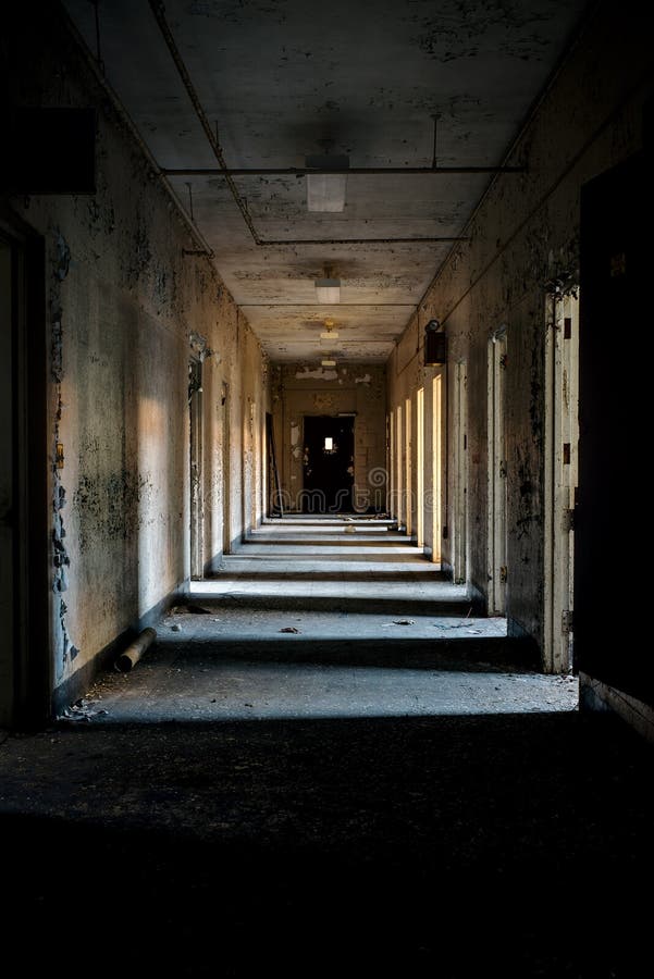 Desolate Hallway with Open Doors - Abandoned Hospital stock photo Desolate Hallway with Open Doors - Abandoned Hospital stock photo