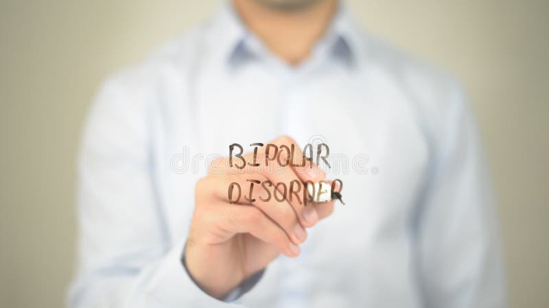 Desorden bipolar, escritura del hombre en la pantalla transparente fotografía de archivo libre de regalías Desorden bipolar, escritura del hombre en la pantalla transparente fotografía de archivo libre de regalías