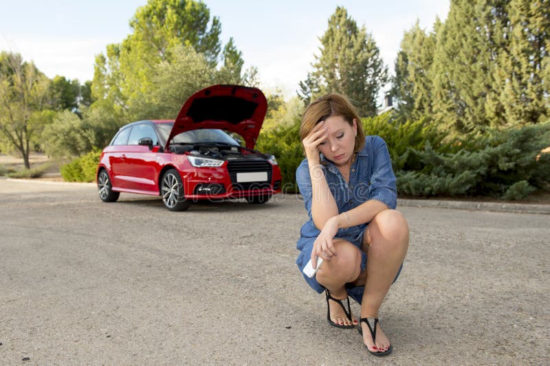 Desperate confused woman stranded with broken car engine crash accident calling on mobile phone