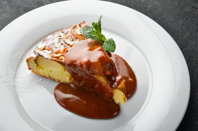 Dessert. Biscuit Apple Pie with Caramel Topping on a Plate Stock Photo