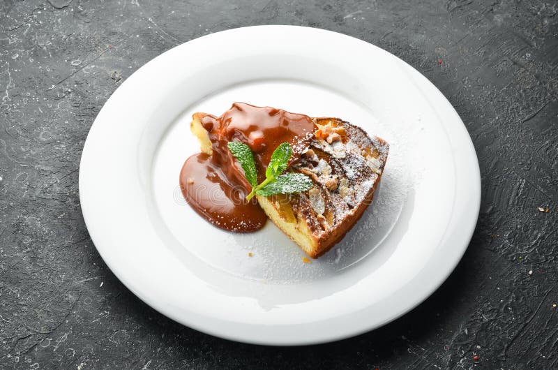 Dessert. Biscuit Apple Pie with Caramel Topping on a Plate Stock Photo