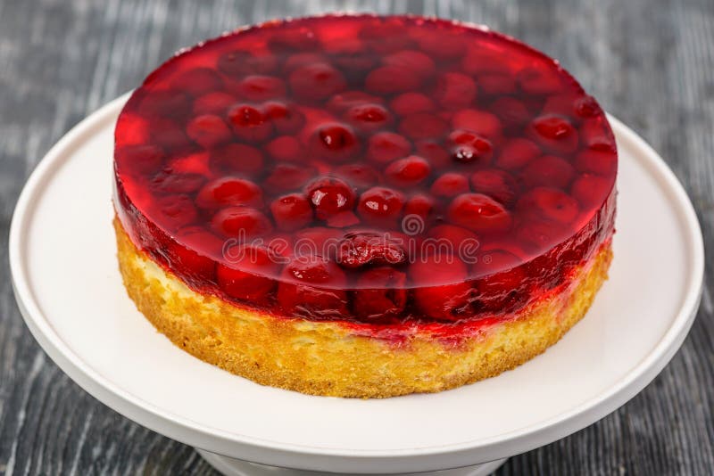 Dessert Biscuit Cake with Cream and Cherries in Jelly Stock Photo