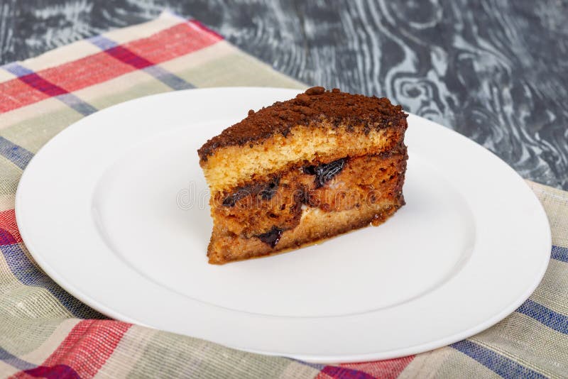 Dessert biscuit cake with nuts and prunes in restaurant serving. Dessert biscuit cake with nuts and prunes stock photo Dessert biscuit cake with nuts and prunes in restaurant serving. Dessert biscuit cake with nuts and prunes stock photo