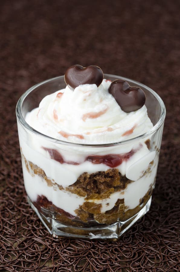 Dessert with black bread, jam and whipped cream