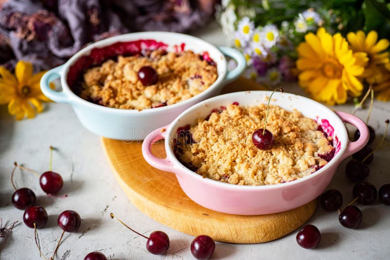 Dessert for breakfast: cherry crumble in beautiful shapes. Close-up