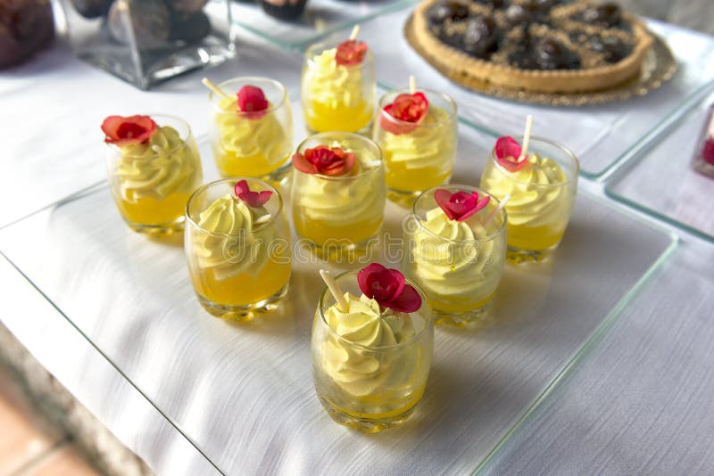 Dessert Buffet with Single Portions of Saffron Mousse Stock Photo