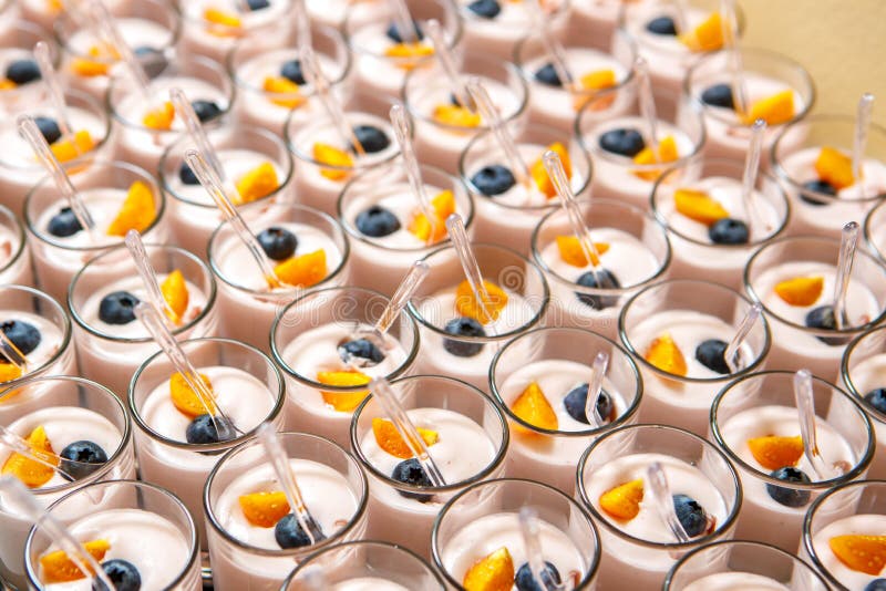 Dessert in Cups of Yogurt, Blueberries and Cherry Tomatoes Stock Image
