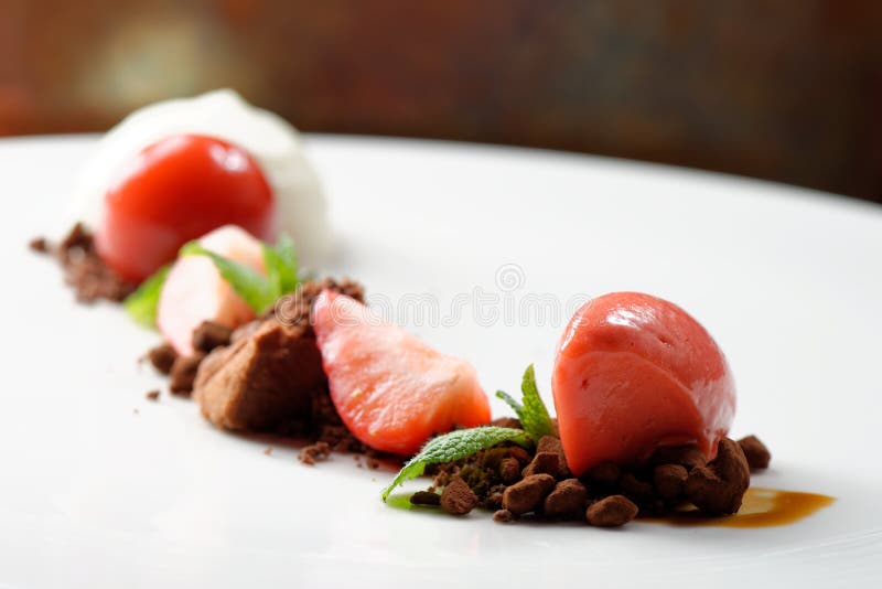 Fine dining dessert, Strawberry ice cream, chocolate mousse and spices. Fine dining dessert, Strawberry ice cream, chocolate mousse and spices